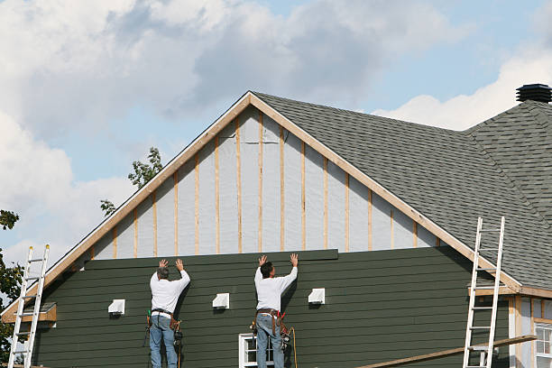Professional Siding Contractor technician working in Victoria, TX